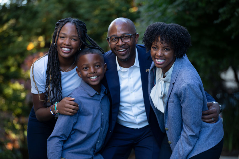 Loren and his immediate family, smiling for portrait